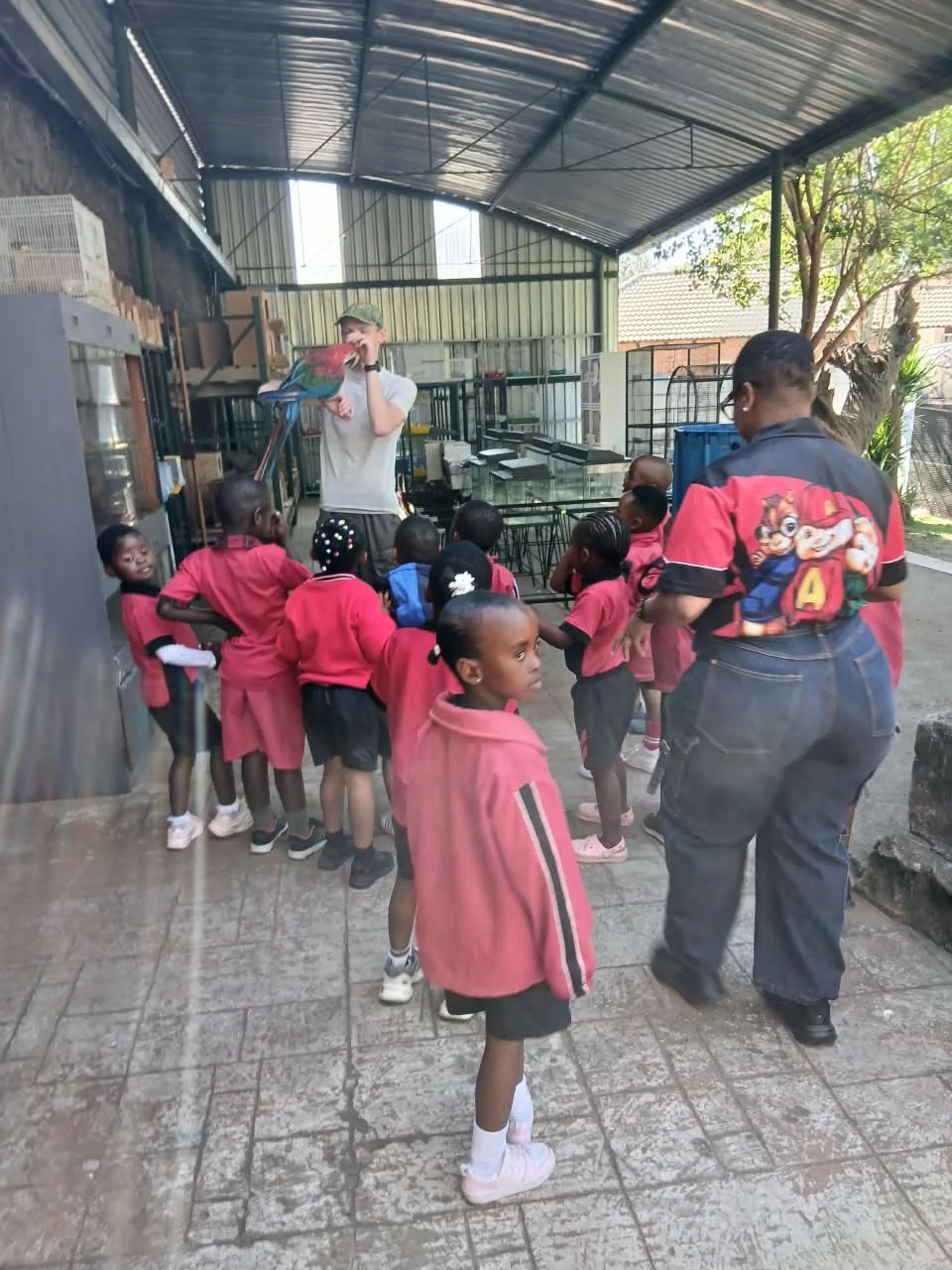 Primary school children writing in their classroom at Light Bearers Academy